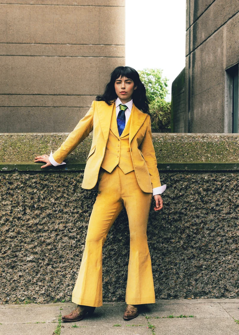 Mustard three-piece suit with flared trousers